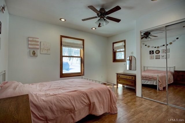 bedroom featuring a ceiling fan, recessed lighting, and wood finished floors