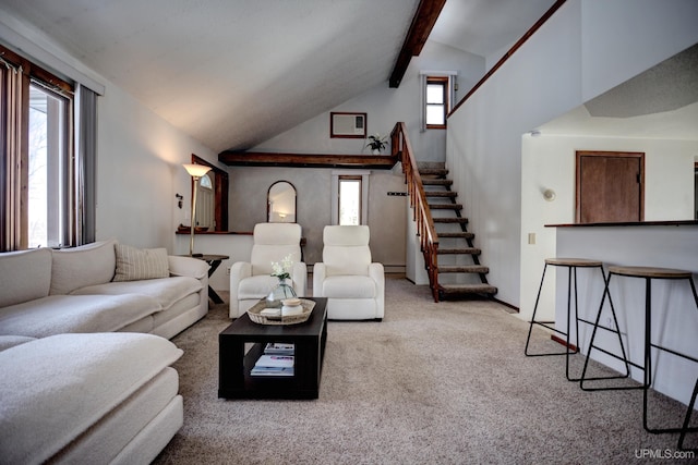 living area featuring beam ceiling, stairway, carpet flooring, and high vaulted ceiling