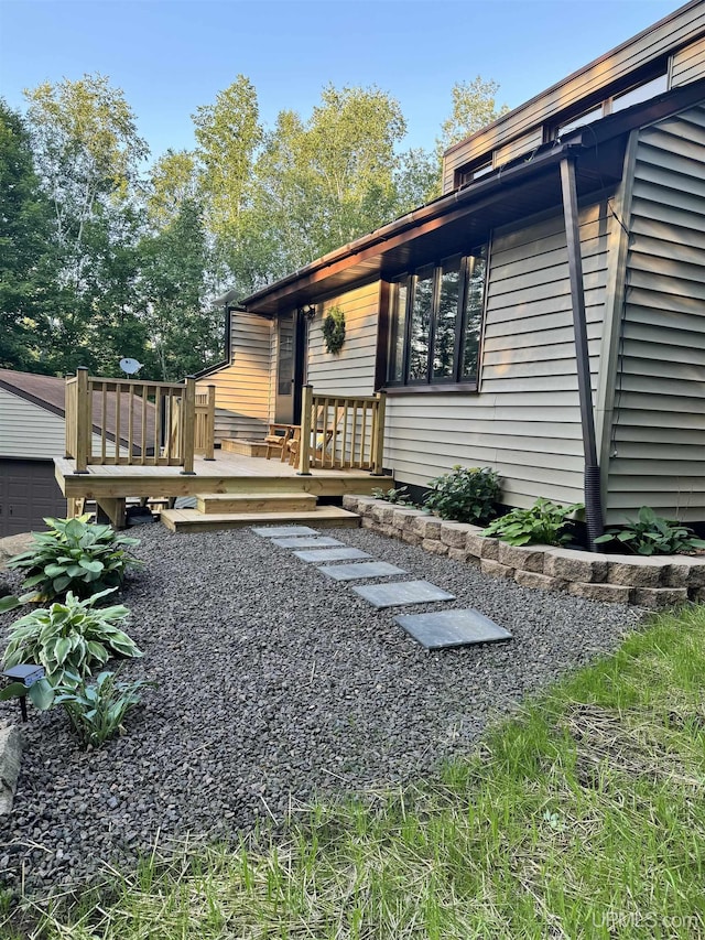 exterior space featuring a wooden deck