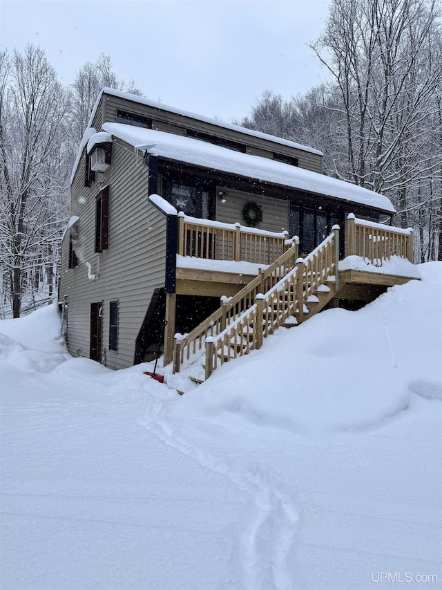 view of front facade featuring a deck and stairway