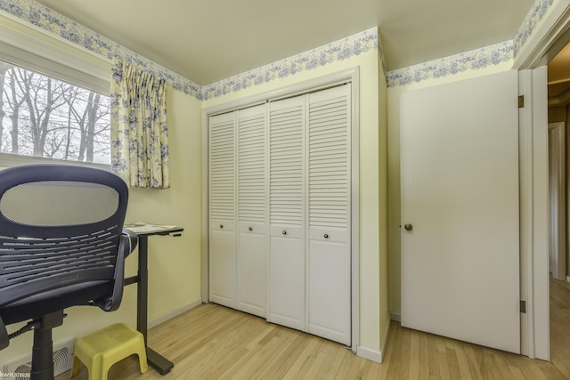 home office featuring visible vents, baseboards, and light wood-style flooring