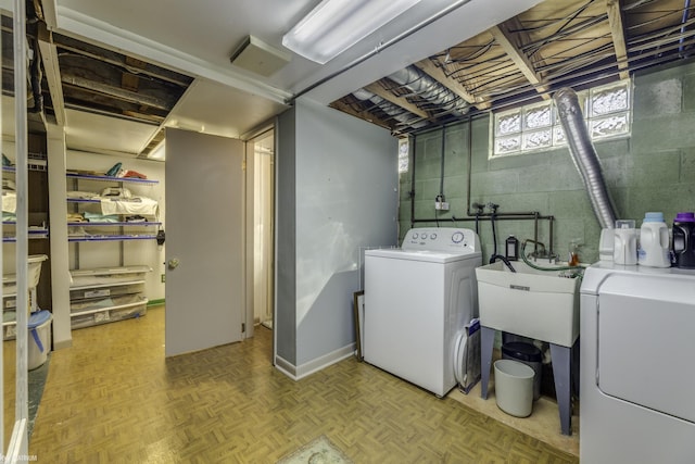 clothes washing area featuring laundry area and washer and dryer