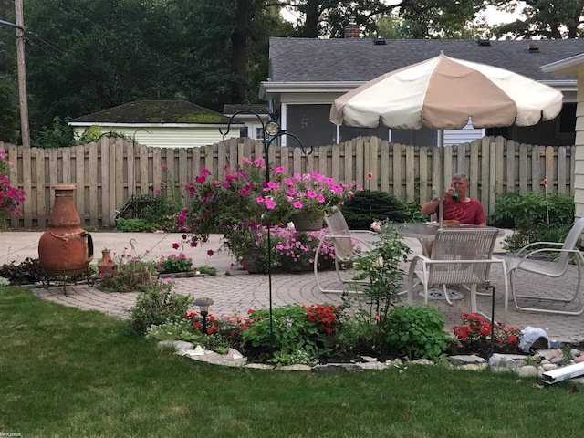 view of yard with a patio and fence