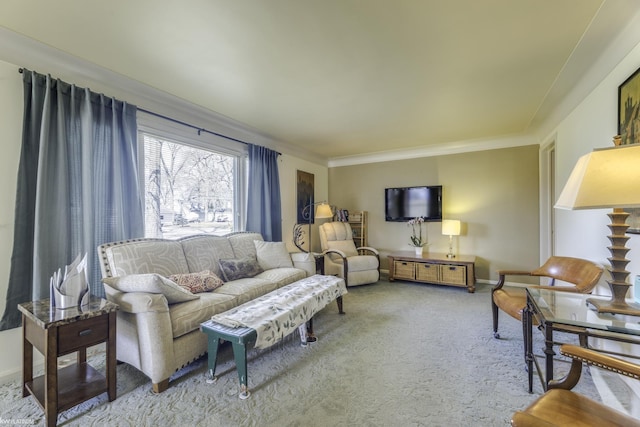 carpeted living area with baseboards and crown molding