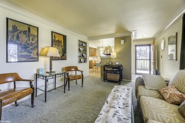 carpeted living room featuring baseboards