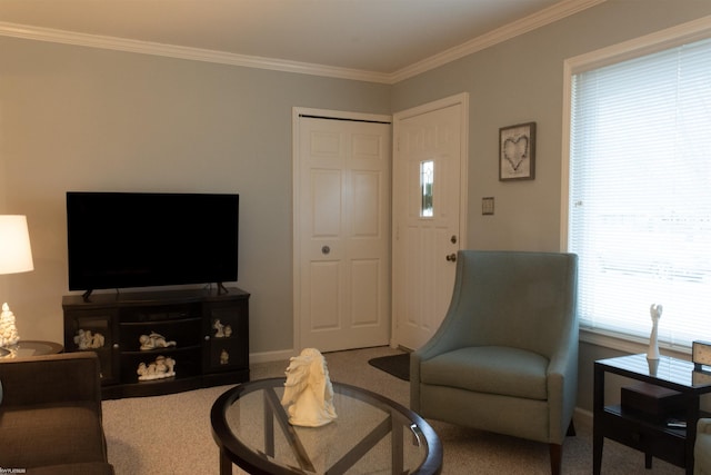 carpeted living room featuring baseboards and ornamental molding