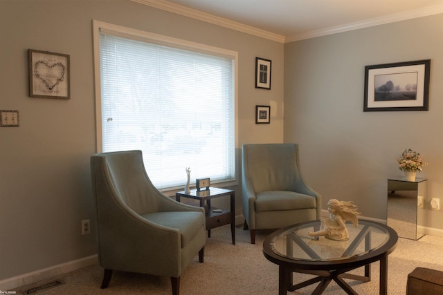 sitting room featuring baseboards, visible vents, carpet floors, and ornamental molding