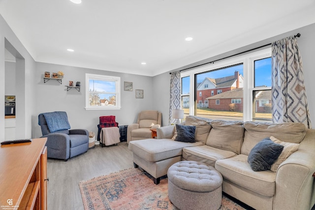 living room with recessed lighting and light wood-type flooring