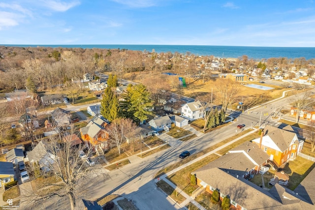 bird's eye view featuring a water view and a residential view