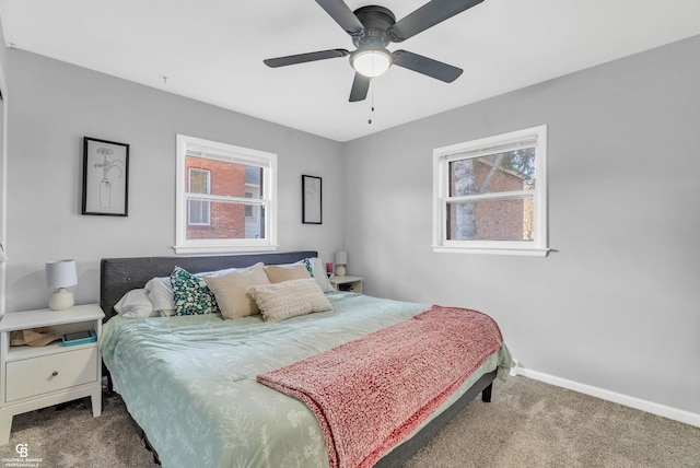 bedroom featuring baseboards, ceiling fan, and carpet flooring