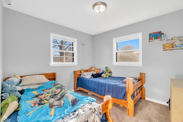 bedroom with baseboards and carpet flooring