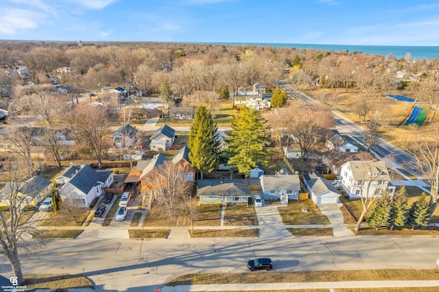 bird's eye view featuring a residential view and a water view