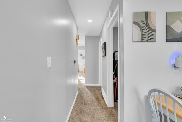 hall with carpet flooring and baseboards