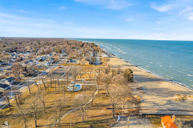 birds eye view of property with a view of the beach and a water view