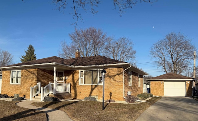 view of front of property with brick siding, a chimney, a garage, an outbuilding, and driveway