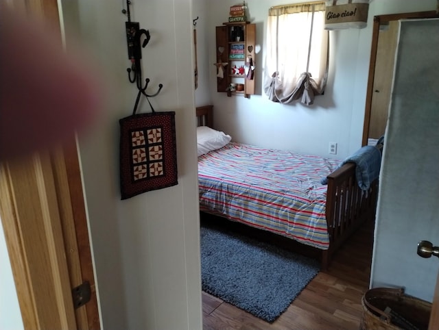 bedroom with wood finished floors