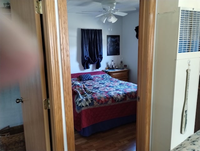 bedroom featuring wood finished floors and ceiling fan