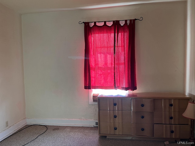 unfurnished bedroom with baseboards