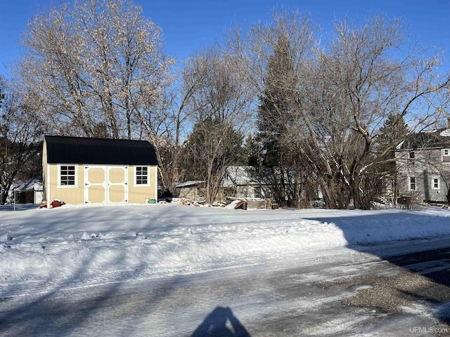 exterior space featuring an outbuilding and a storage unit