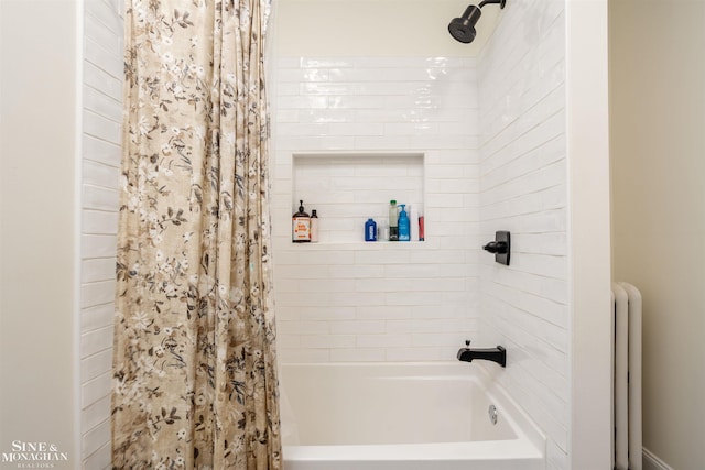 full bathroom with shower / bath combo and radiator heating unit