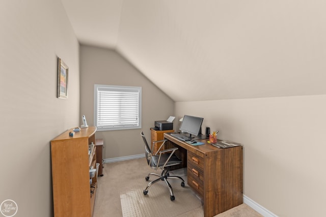 office with baseboards, lofted ceiling, and light colored carpet