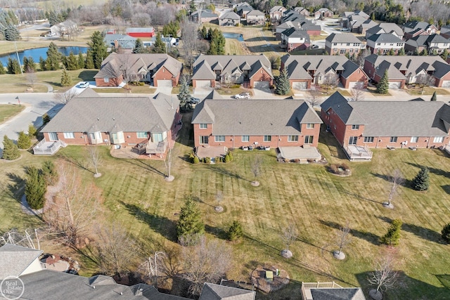 aerial view featuring a residential view and a water view