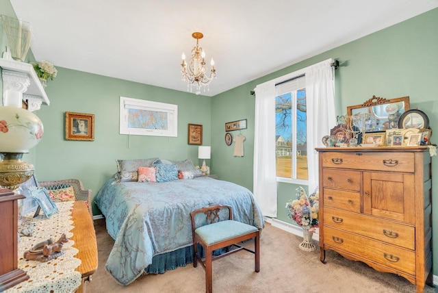 carpeted bedroom with baseboards and an inviting chandelier