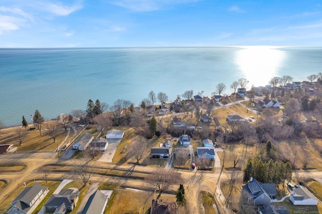 drone / aerial view with a residential view and a water view