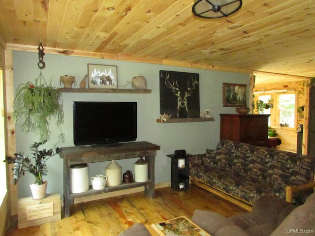 living area with wood ceiling and wood finished floors