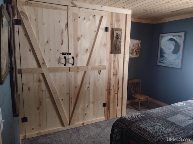 unfurnished bedroom with wood ceiling