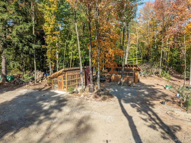 view of poultry coop with a forest view