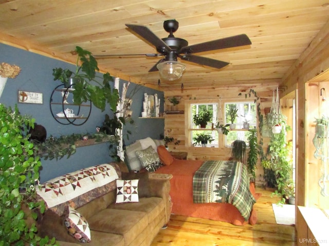 bedroom with wood ceiling and wood finished floors