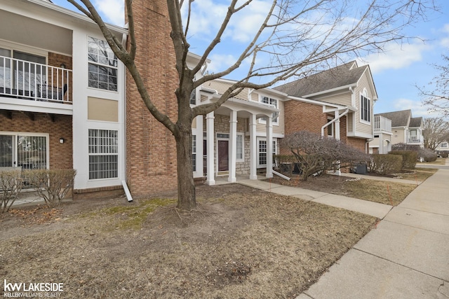 exterior space with brick siding