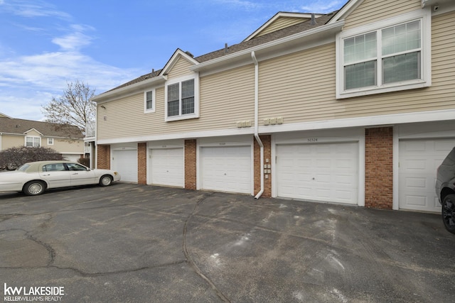 view of side of home with brick siding