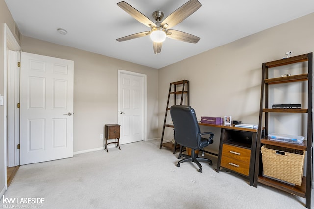 office with a ceiling fan, light colored carpet, and baseboards