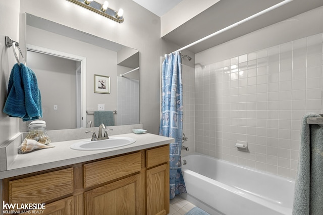 bathroom featuring vanity, tile patterned floors, and shower / tub combo