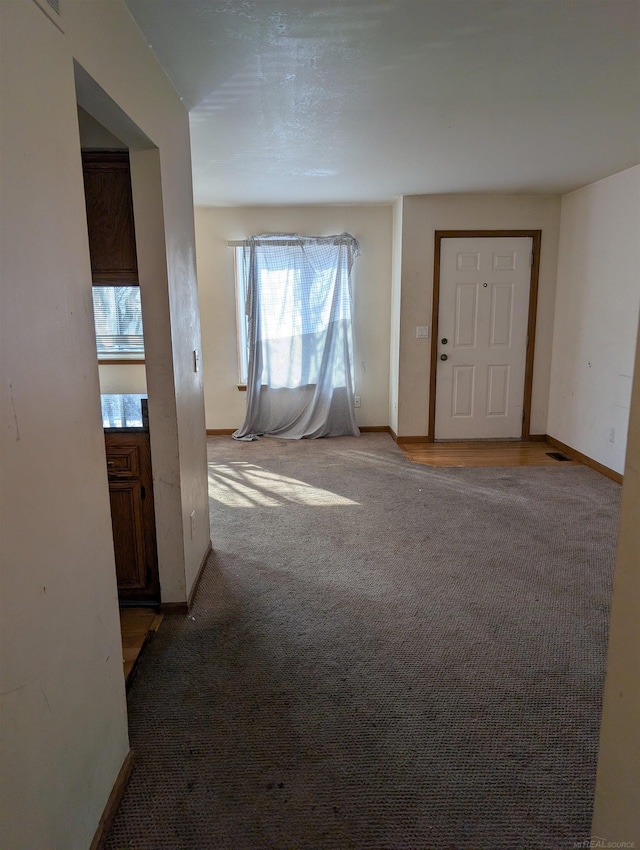 interior space featuring baseboards