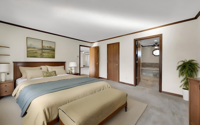 bedroom featuring light carpet, ensuite bath, crown molding, and baseboards