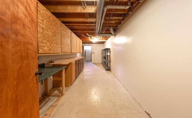 unfinished basement featuring light floors