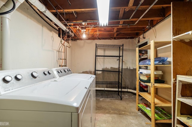 clothes washing area with laundry area and washer and dryer