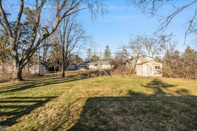 view of yard with a storage shed and an outdoor structure