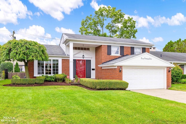 view of front of home with brick siding, a garage, driveway, and a front yard