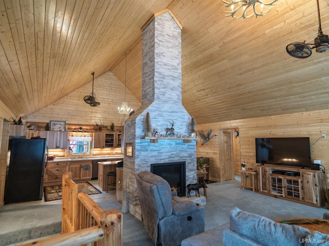 living area with high vaulted ceiling, wood ceiling, light colored carpet, and a large fireplace