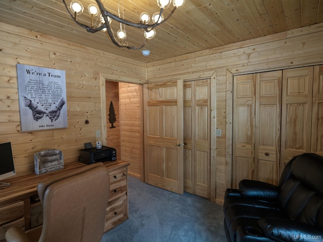 office area with wooden ceiling, carpet, and wood walls