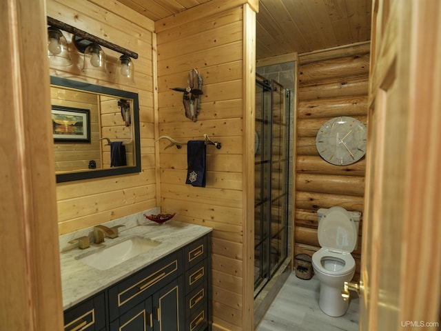 bathroom with toilet, wooden ceiling, a stall shower, wood finished floors, and vanity