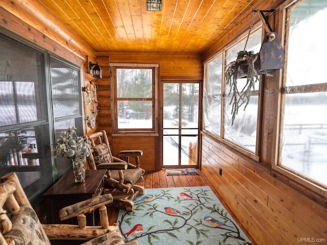 sunroom featuring wooden ceiling