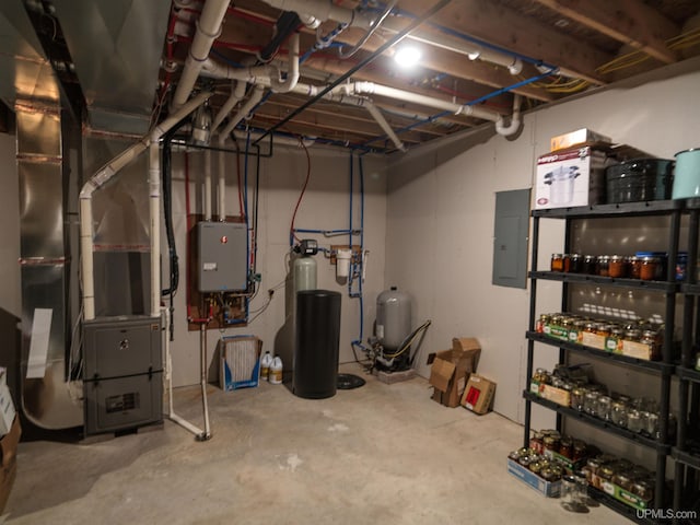 unfinished below grade area with heating unit, electric panel, and water heater