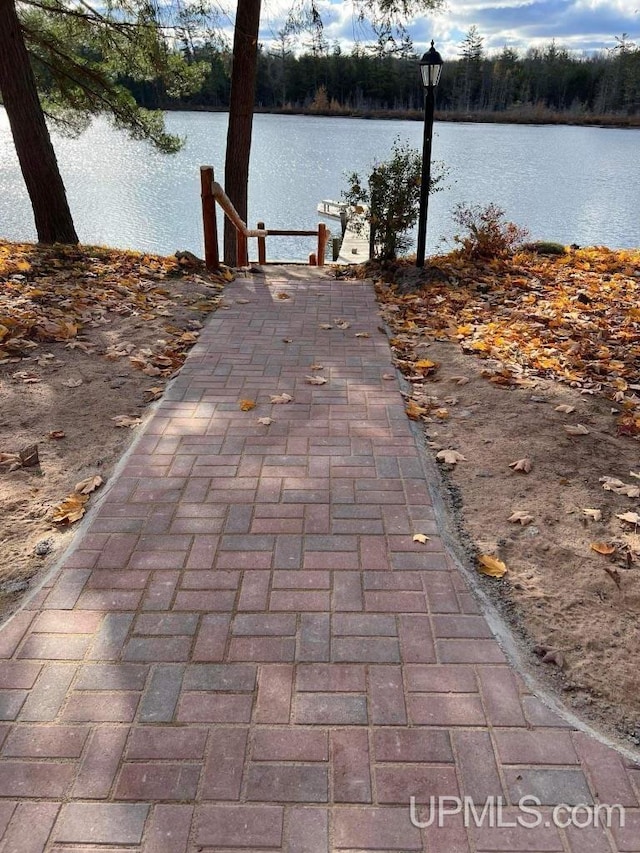 view of patio with a water view