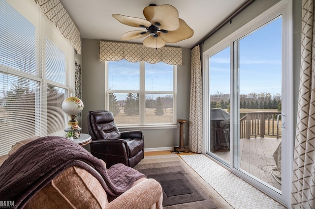 sunroom with a ceiling fan