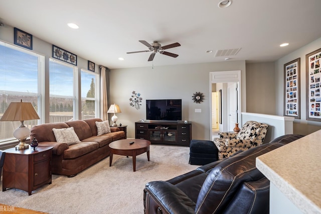 living room featuring recessed lighting, light colored carpet, visible vents, and ceiling fan